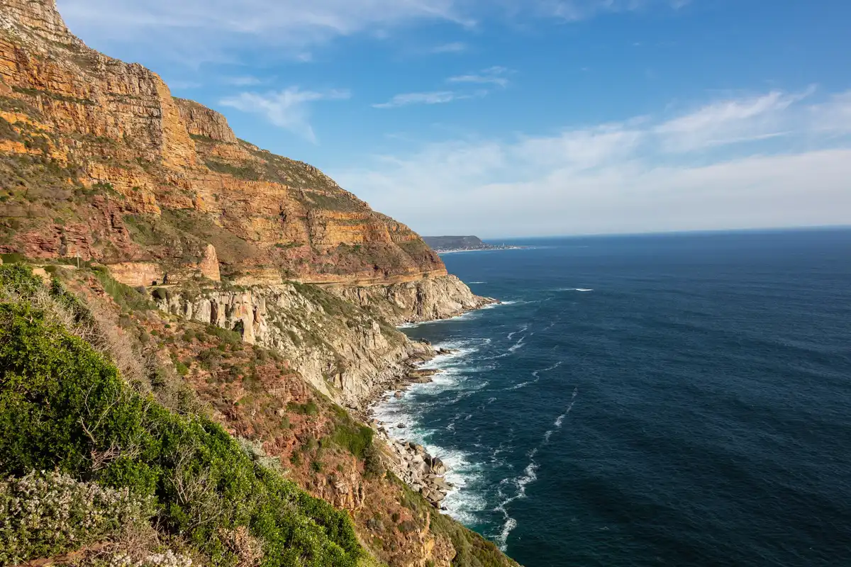 The Atlantic coastline and the curve of Chapman's Peak Drive beneath the Cape mountains